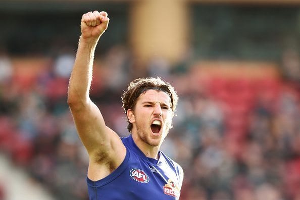 ADELAIDE, AUSTRALIA - JUNE 11: Marcus Bontempelli of the Bulldogs celebrates after kicking a goal during the round 12 AFL match between the Port Adelaide Power and the Western Bulldogs at Adelaide Oval on June 11, 2016 in Adelaide, Australia. (Photo by Morne de Klerk/Getty Images)