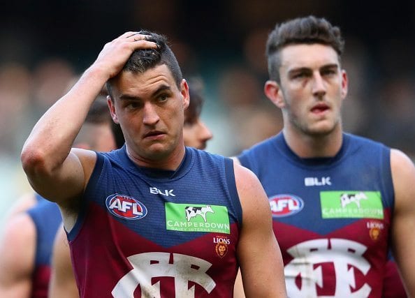 MELBOURNE, AUSTRALIA - JUNE 25: Tom Rockliff of the Lions looks dejected as the Lions leave the field after losing the round 14 AFL match between the Richmond Tigers and the Brisbane Lions at Melbourne Cricket Ground on June 25, 2016 in Melbourne, Australia. (Photo by Quinn Rooney/Getty Images)