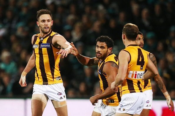 ADELAIDE, AUSTRALIA - JULY 07: Jack Gunston of the Hawks celebrates with teammates after he kicked a goal during the round 16 AFL match between the Port Adelaide Power and the Hawthorn Hawks at Adelaide Oval on July 7, 2016 in Adelaide, Australia.  (Photo by Morne de Klerk/Getty Images)