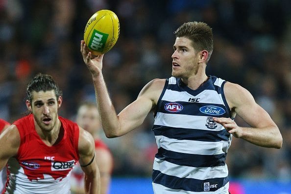 GEELONG, AUSTRALIA - JULY 08: Zac Smith of the Cats looks upfield with the ball during the round 16 AFL match between the Geelong Cats and the Sydney Swans at Simonds Stadium on July 8, 2016 in Geelong, Australia.  (Photo by Michael Dodge/Getty Images)