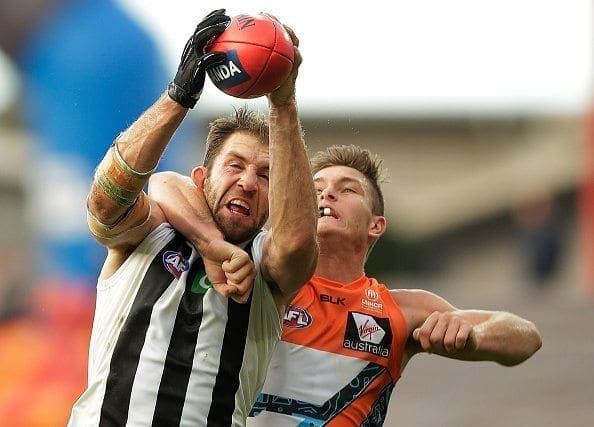 SYDNEY, AUSTRALIA - JULY 09: Travis Cloke of the Magpies marks the ball over Adam Tomlinson of the Giants during the round 16 AFL match between the Greater Western Sydney Giants and the Collingwood Magpies at Spotless Stadium on July 9, 2016 in Sydney, Australia. (Photo by Mark Metcalfe/Getty Images)