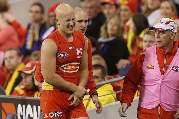 GOLD COAST, AUSTRALIA - JULY 09: Gary Ablett of the Suns leaves the field injured during the round 16 AFL match between the Gold Coast Suns and the Brisbane Lions at Metricon Stadium on July 9, 2016 in Gold Coast, Australia. (Photo by Chris Hyde/Getty Images)