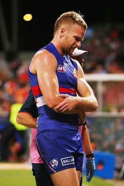 CAIRNS, AUSTRALIA - JULY 16: Jake Stringer of the Bulldogs comes off with an injury during the round 17 AFL match between the Western Bulldogs and the Gold Coast Suns at Cazaly's Stadium on July 16, 2016 in Cairns, Australia. (Photo by Michael Dodge/Getty Images)
