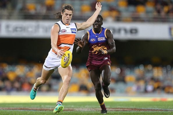 BRISBANE, AUSTRALIA - JULY 17: Jack Steele of the Giants kicks during the round 17 AFL match between the Brisbane Broncos and the Greater Western Sydney Giants at The Gabba on July 17, 2016 in Brisbane, Australia. (Photo by Chris Hyde/Getty Images)