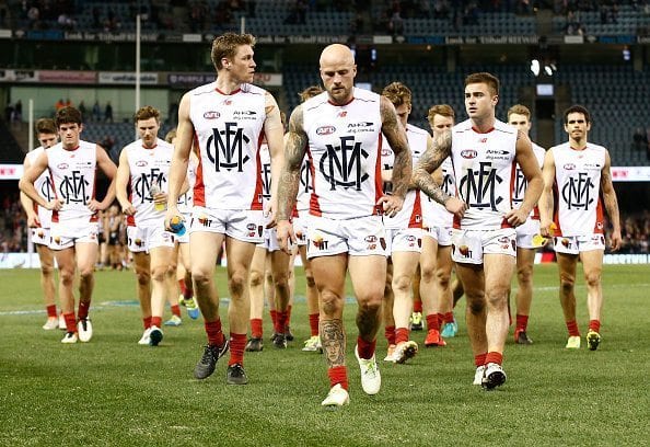 MELBOURNE, AUSTRALIA - JULY 17: Melbourne players look dejected after a loss during the 2016 AFL Round 17 match between the St Kilda Saints and the Melbourne Demons at Etihad Stadium on July 17, 2016 in Melbourne, Australia. (Photo by Adam Trafford/AFL Media/Getty Images)