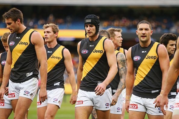 MELBOURNE, AUSTRALIA - JULY 24: Ben Griffiths of the Tigers leads the team out at half time during the round 18 AFL match between the Hawthorn Hawks and the Richmond Tigers at Melbourne Cricket Ground on July 24, 2016 in Melbourne, Australia. (Photo by Michael Dodge/Getty Images)
