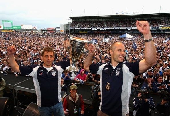 GEELONG, AUSTRALIA - SEPTEMBER 30:   Geelong Cats coach Mark Thompson and captain Tom Harley hold up the premiership cup during a Geelong Cats AFL Premiership Celebration day at Skilled Stadium on September 30, 2007 in Geelong, Australia.  (Photo by Mark Dadswell/Getty Images)