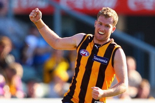 LAUNCESTON, AUSTRALIA - AUGUST 12: Xavier Ellis of the Hawks celebrates kicking a goal during the round 20 AFL match between the Hawthorn Hawks and the Port Adelaide Power at Aurora Stadium on August 12, 2012 in Launceston, Australia. (Photo by Robert Prezioso/Getty Images)