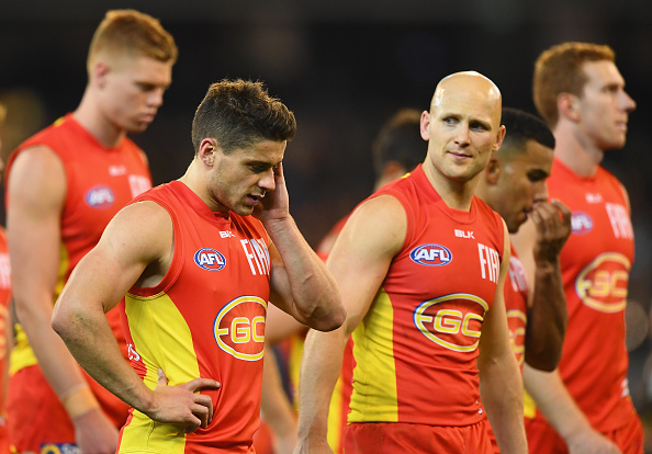 MELBOURNE, AUSTRALIA - JUNE 12: Dion Prestia and Gary Ablett of the Suns look dejected after losing the round 12 AFL match between the Richmond Tigers and the Gold Coast Suns at Melbourne Cricket Ground on June 12, 2016 in Melbourne, Australia. (Photo by Quinn Rooney/Getty Images)