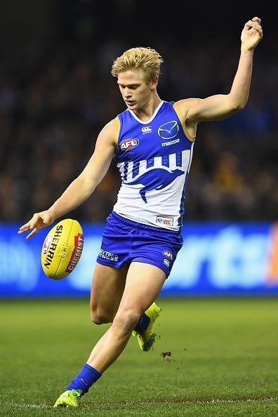 MELBOURNE, AUSTRALIA - JUNE 17: Corey Wagner of the Kangaroos kicks during the round 13 AFL match between the North Melbourne Kangaroos and the Hawthorn Hawks at Etihad Stadium on June 17, 2016 in Melbourne, Australia. (Photo by Quinn Rooney/Getty Images)