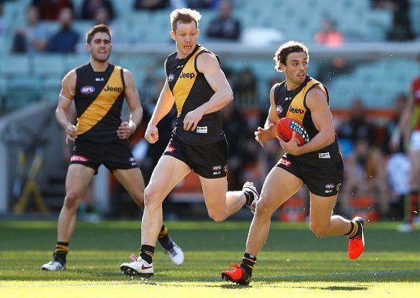 MELBOURNE, AUSTRALIA - JULY 16: Sam Lloyd of the Tigers in action during the 2016 AFL Round 17 match between the Richmond Tigers and the Essendon Bombers at the Melbourne Cricket Ground on July 16, 2016 in Melbourne, Australia. (Photo by Adam Trafford/AFL Media/Getty Images)