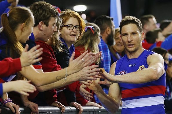 MELBOURNE, AUSTRALIA - AUGUST 06: Matthew Boyd of the Bulldogs celebrates the win with fans during the round 20 AFL match between the Western Bulldogs and the North Melbourne Kangaroos at Etihad Stadium on August 6, 2016 in Melbourne, Australia. (Photo by Michael Dodge/Getty Images)