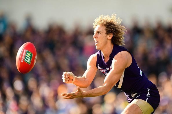 PERTH, AUSTRALIA - AUGUST 07: Chris Mayne of the Dockers handpasses the ball during the 2016 AFL Round 20 match between the Fremantle Dockers and the West Coast Eagles at Domain Stadium on August 07, 2016 in Perth, Australia. (Photo by Daniel Carson/AFL Media/Getty Images)