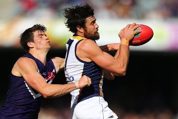 PERTH, AUSTRALIA - AUGUST 07: Josh Kennedy of the Eagles marks the ball against Sam Collins of the Dockers during the round 20 AFL match between the Fremantle Dockers and the West Coast Eagles at Domain Stadium on August 7, 2016 in Perth, Australia. (Photo by Paul Kane/Getty Images)