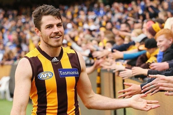 MELBOURNE, AUSTRALIA - AUGUST 13: Isaac Smith of the Hawks celebrates the win with fans during the round 21 AFL match between the Hawthorn Hawks and the North Melbourne Kangaroos at Melbourne Cricket Ground on August 13, 2016 in Melbourne, Australia.  (Photo by Michael Dodge/Getty Images)