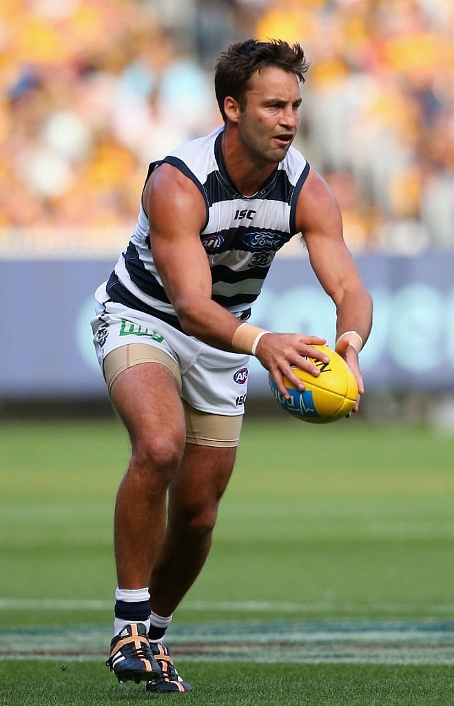 MELBOURNE, AUSTRALIA - APRIL 06:  Jimmy Bartel of the Cats kicks during the round one AFL match between the Hawthorn Hawks and the Geelong Cats at Melbourne Cricket Ground on April 6, 2015 in Melbourne, Australia.  (Photo by Quinn Rooney/Getty Images)