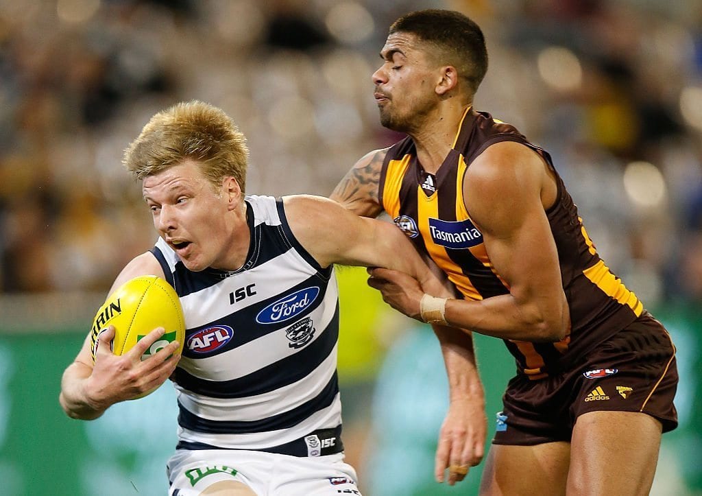 MELBOURNE, AUSTRALIA - AUGUST 15: George Horlin-Smith of the Cats is tackled by Bradley Hill of the Hawks during the 2015 AFL round 20 match between the Geelong Cats and the Hawthorn Hawks at the Melbourne Cricket Ground, on August 15, 2015 in Melbourne, Australia. (Photo by Michael Willson/AFL Media/Getty Images)
