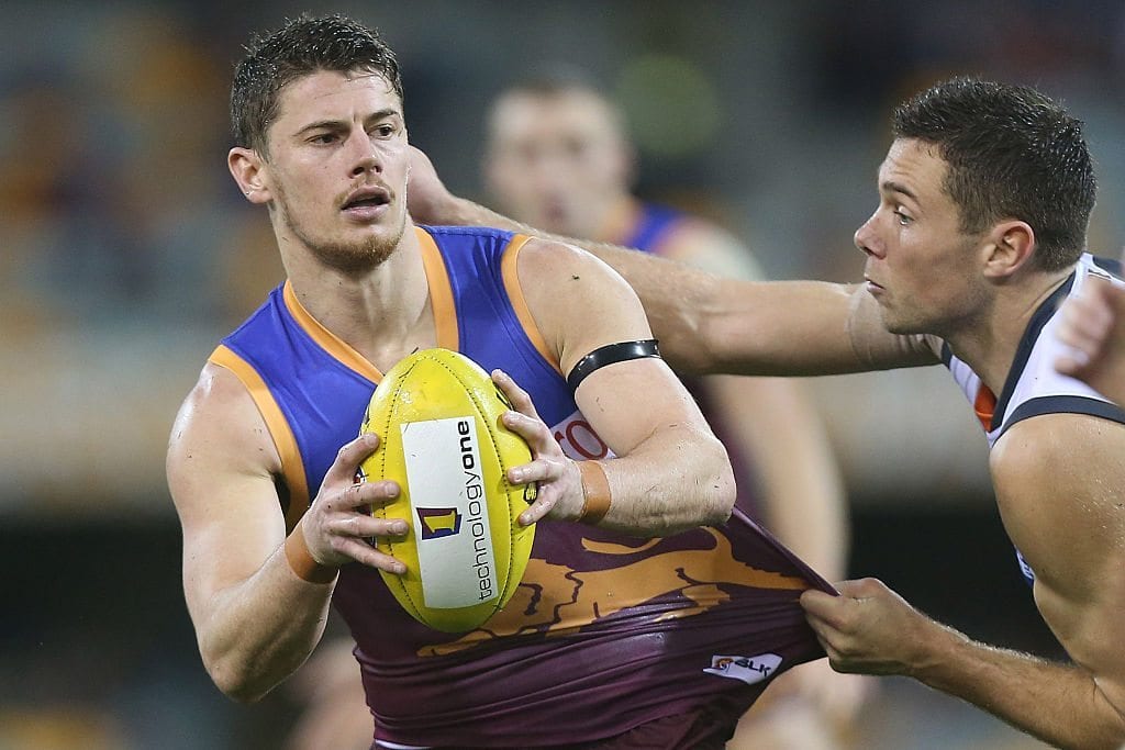 Dayne Zorko of the Lions is tackled during the round 17 AFL match between the Brisbane Broncos and the Greater Western Sydney Giants at The Gabba on July 17, 2016 in Brisbane, Australia. (Photo by Chris Hyde/Getty Images)