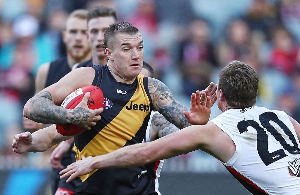 Dustin Martin of the Tigers fends off David Armitage of the Saints during the round 22 AFL match between the Richmond Tigers and the St Kilda Saints at Melbourne Cricket Ground on August 20, 2016 in Melbourne, Australia. (Photo by Scott Barbour/Getty Images)