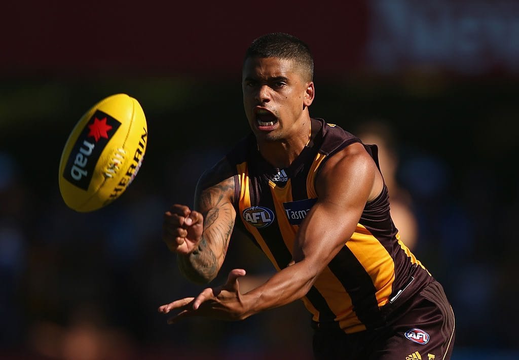 SHEPPARTON, AUSTRALIA - MARCH 08: Bradley Hill of the Hawks handballs during the NAB Challenge AFL match between the North Melbourne Kangaroos and the Hawthorn Hawks at Deakin Reserve on March 8, 2015 in Shepparton, Australia. (Photo by Robert Cianflone/Getty Images)