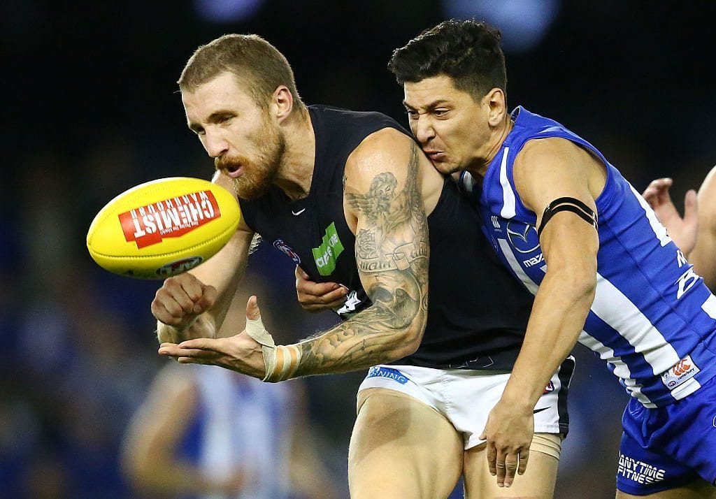 MELBOURNE, AUSTRALIA - MAY 21: Zach Tuohy of the Blues is tackled by Robin Nahas of the Kangaroos during the round nine AFL match between the North Melbourne Kangaroos and the Carlton Blues at Etihad Stadium on May 21, 2016 in Melbourne, Australia. (Photo by Scott Barbour/Getty Images)