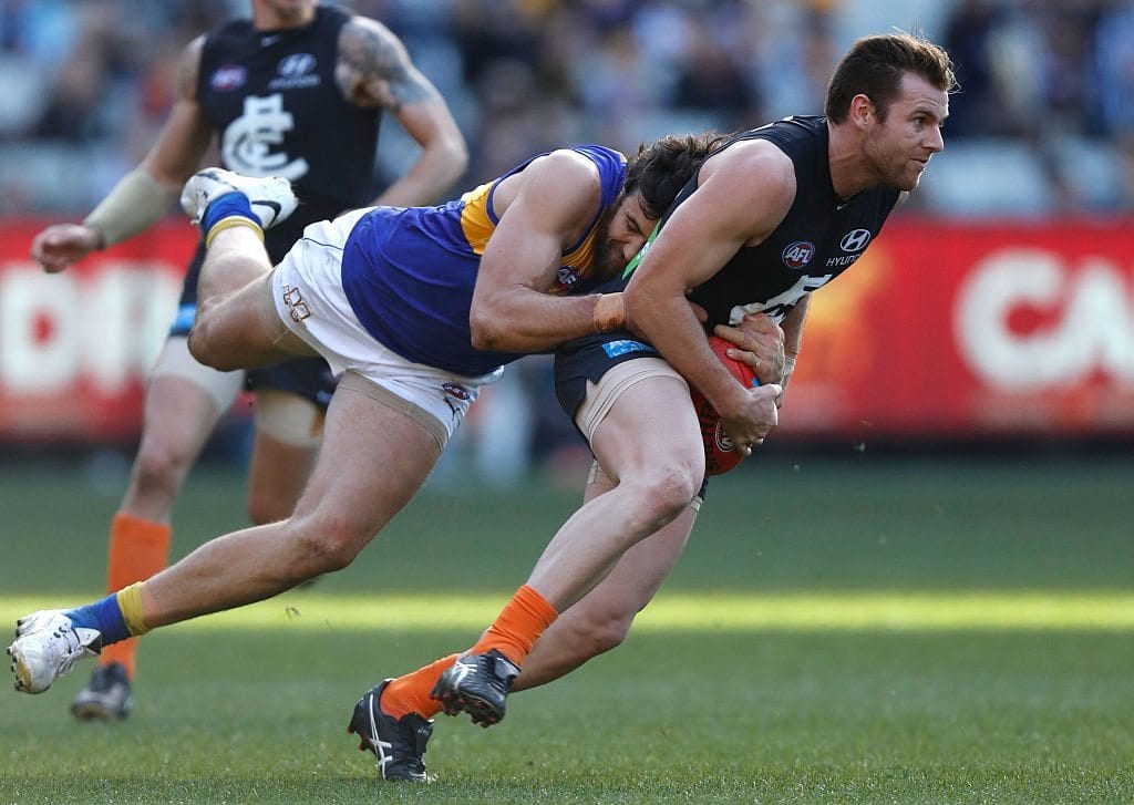 MELBOURNE, AUSTRALIA - JULY 17: Sam Docherty of the Blues is tackled by Josh Kennedy of the Eagles during the 2016 AFL Round 17 match between the Carlton Blues and the West Coast Eagles at the Melbourne Cricket Ground on July 17, 2016 in Melbourne, Australia. (Photo by Michael Willson/AFL Media/Getty Images)