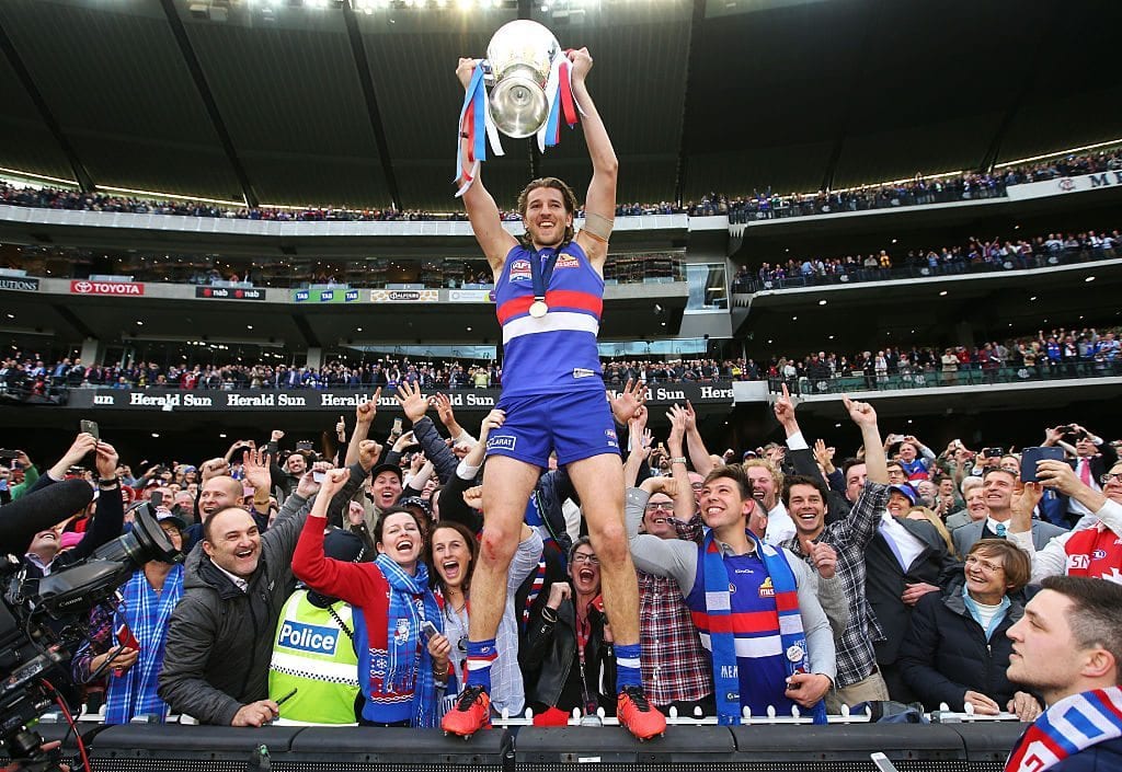 MELBOURNE, VICTORIA - OCTOBER 01:  Marcus Bontempelli of the Bulldogs celebrates the win with fans during the 2016 AFL Grand Final match between the Sydney Swans and the Western Bulldogs at Melbourne Cricket Ground on October 1, 2016 in Melbourne, Australia.  (Photo by Darrian Traynor/AFL Media/Getty Images)
