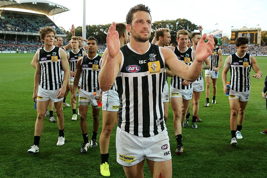 ADELAIDE, AUSTRALIA - SEPTEMBER 07: Travis Boak of the Power leads his team from the field after the First Elimination Final match between the Port Adelaide Power and the Richmond Tigers at Adelaide Oval on September 7, 2014 in Adelaide, Australia. (Photo by Morne de Klerk/Getty Images)