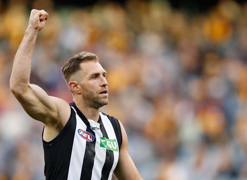 MELBOURNE, AUSTRALIA - AUGUST 28: Travis Cloke of the Magpies celebrates a goal during the 2016 AFL Round 23 match between the Hawthorn Hawks and the Collingwood Magpies at the Melbourne Cricket Ground on August 28, 2016 in Melbourne, Australia. (Photo by Adam Trafford/AFL Media/Getty Images)