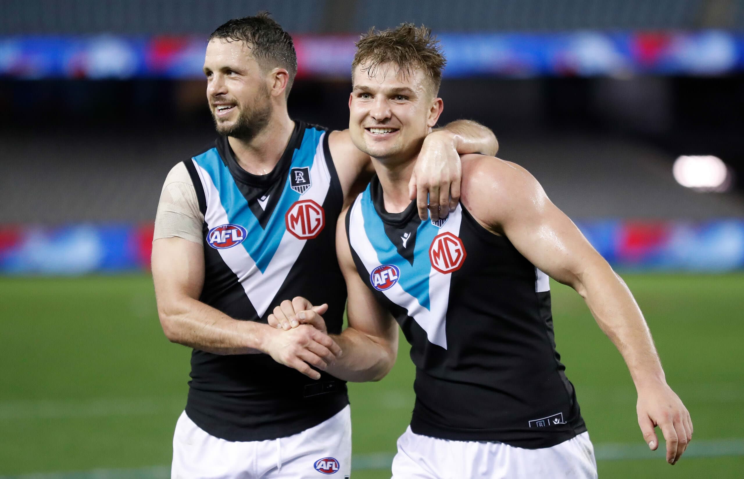 Adelaide, Australia. 03rd June, 2023. Conor Nash of the Hawks is tackled by Dan Houston and Riley Bonner of the Power during the AFL Round 12 match between the Port Adelaide Power