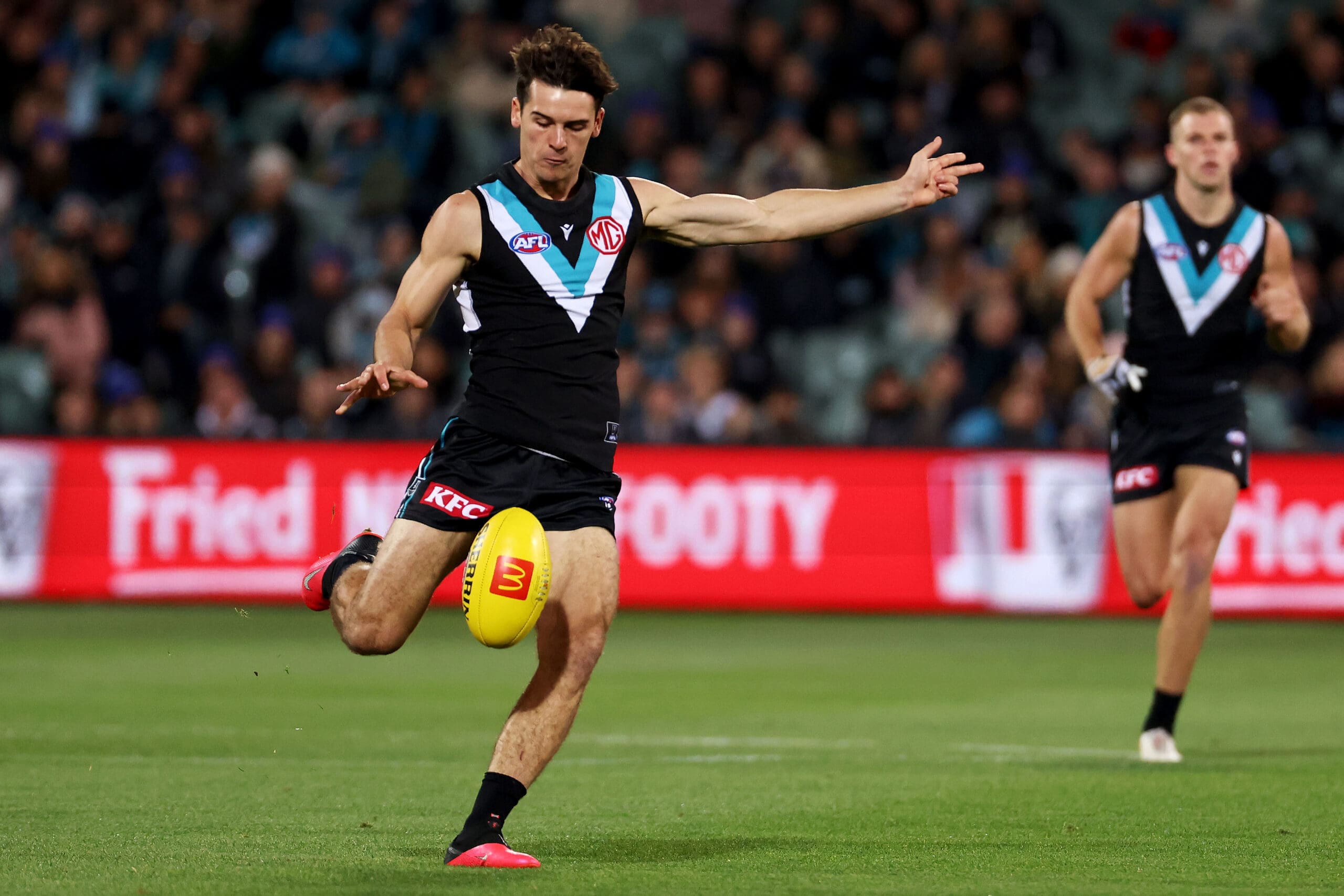 Adelaide, Australia. 03rd June, 2023. Conor Nash of the Hawks is tackled by Dan Houston and Riley Bonner of the Power during the AFL Round 12 match between the Port Adelaide Power