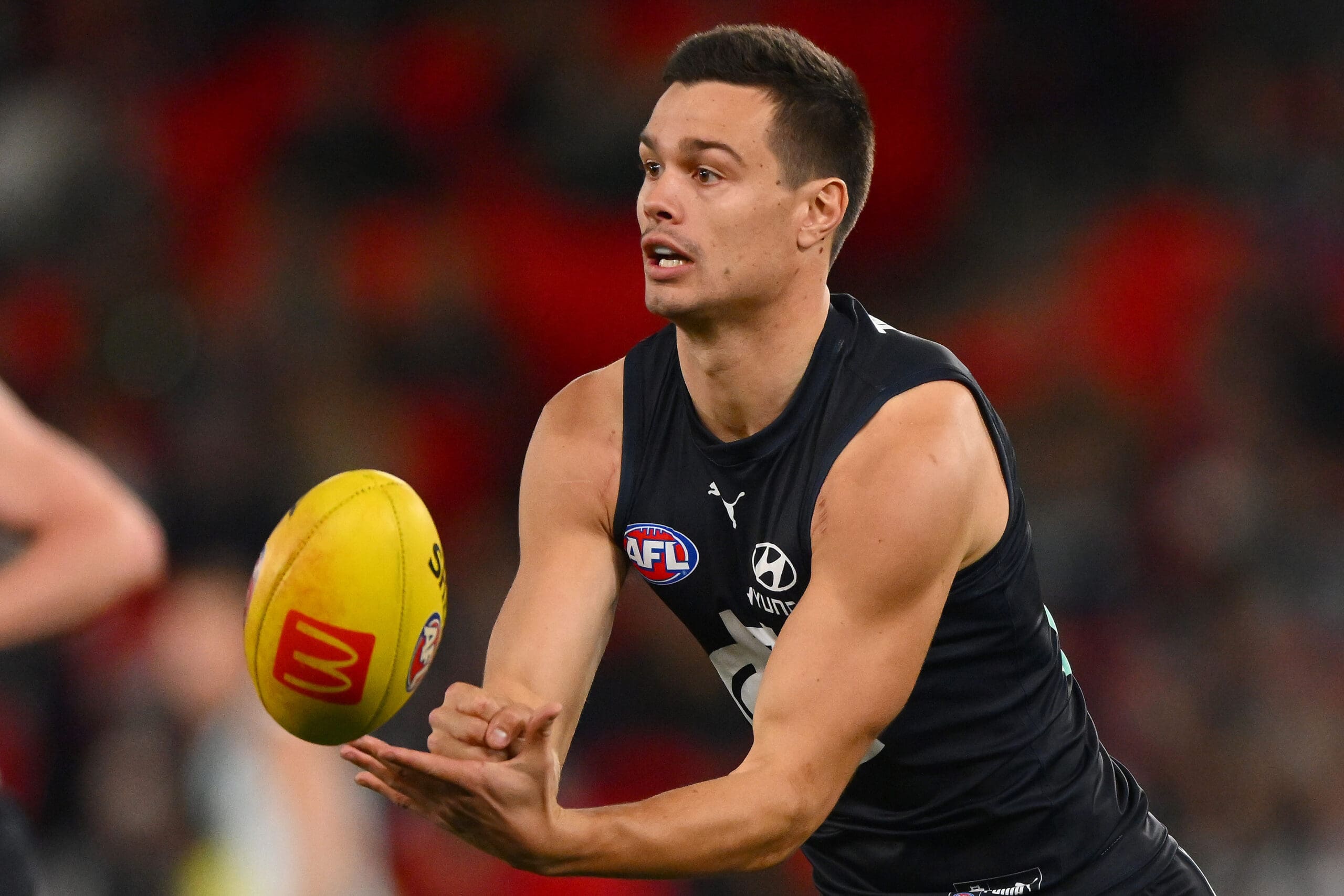 Melbourne, Australia. 02nd June, 2023. Alex Cincotta of Carlton tackles  Kysaiah Pickett of Melbourne during the AFL Round 12 match between the  Melbourne Demons and the Carlton Blues at the Melbourne Cricket