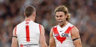 Swans sour reigning premiers' flag unfurling with strong road win
