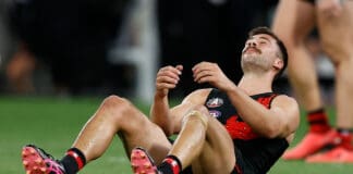 Essendon coach's humane moment with forward following ANZAC Day classic