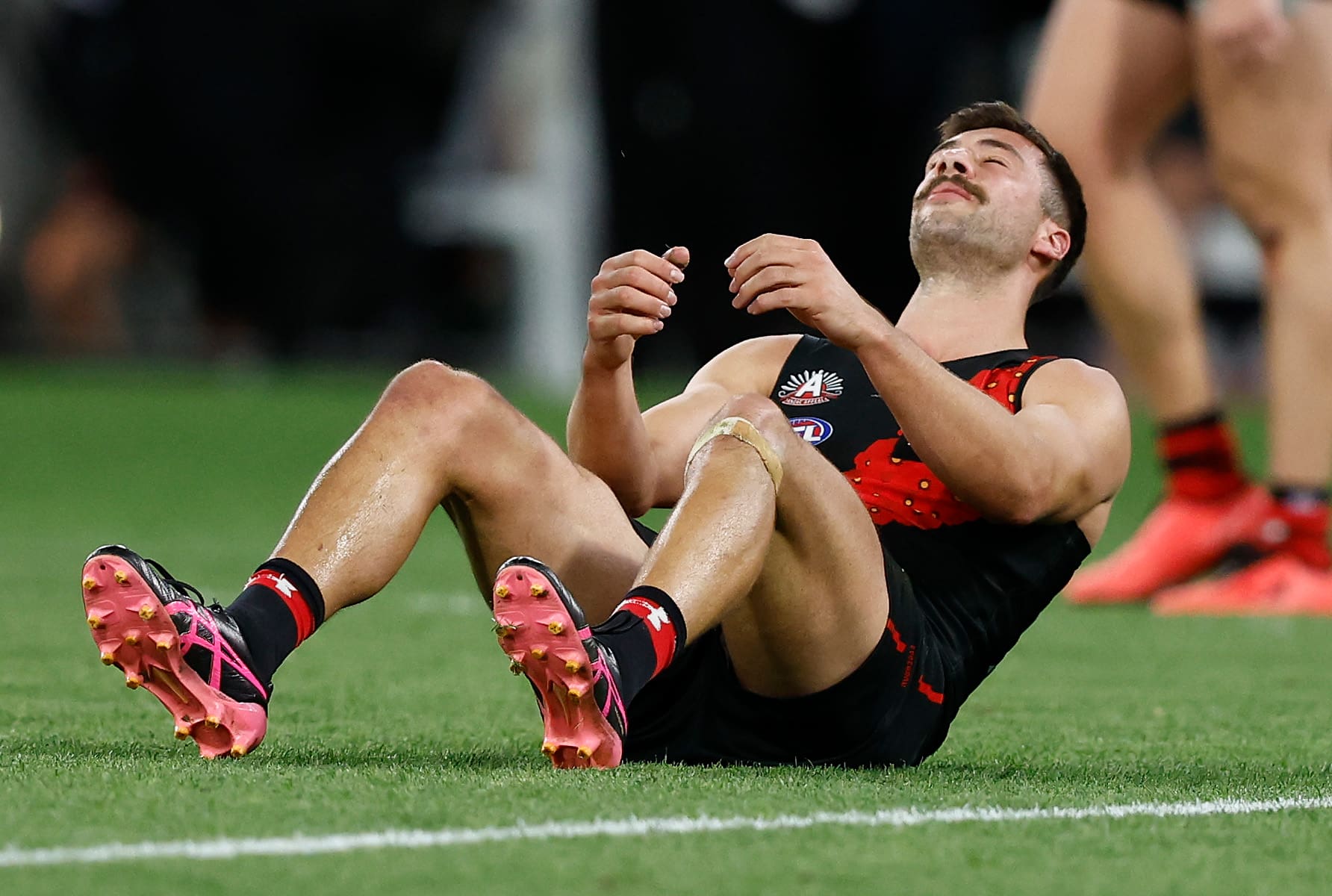 Essendon coach's humane moment with forward following ANZAC Day classic