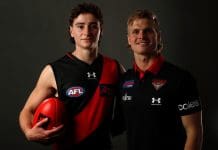 MELBOURNE, AUSTRALIA - NOVEMBER 28: Elijah Tsatas of Essendon poses for a photo with new team mate Ben Hobbs during the 2022 AFL Draft at Marvel Stadium on November 28, 2022 in Melbourne, Australia. (Photo by Darrian Traynor/AFL Photos/Getty Images)