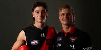 MELBOURNE, AUSTRALIA - NOVEMBER 28: Elijah Tsatas of Essendon poses for a photo with new team mate Ben Hobbs during the 2022 AFL Draft at Marvel Stadium on November 28, 2022 in Melbourne, Australia. (Photo by Darrian Traynor/AFL Photos/Getty Images)