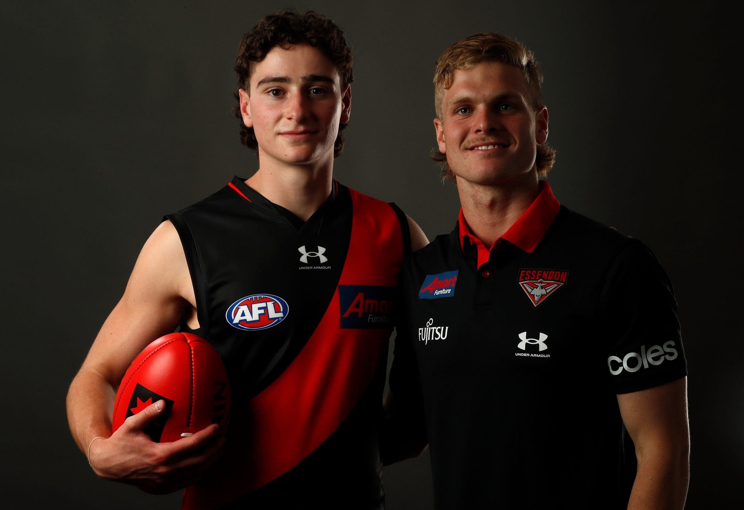 MELBOURNE, AUSTRALIA - NOVEMBER 28: Elijah Tsatas of Essendon poses for a photo with new team mate Ben Hobbs during the 2022 AFL Draft at Marvel Stadium on November 28, 2022 in Melbourne, Australia. (Photo by Darrian Traynor/AFL Photos/Getty Images)
