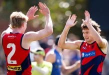 MELBOURNE, AUSTRALIA - FEBRUARY 22: Matthew Jefferson of the Demons celebrates a goal with teammate Jacob van Rooyen during the 2025 AFL match simulation between the North Melbourne Kangaroos and Melbourne Demons at Arden Street on February 22, 2025 in Melbourne, Australia. (Photo by Dylan Burns/AFL Photos via Getty Images)