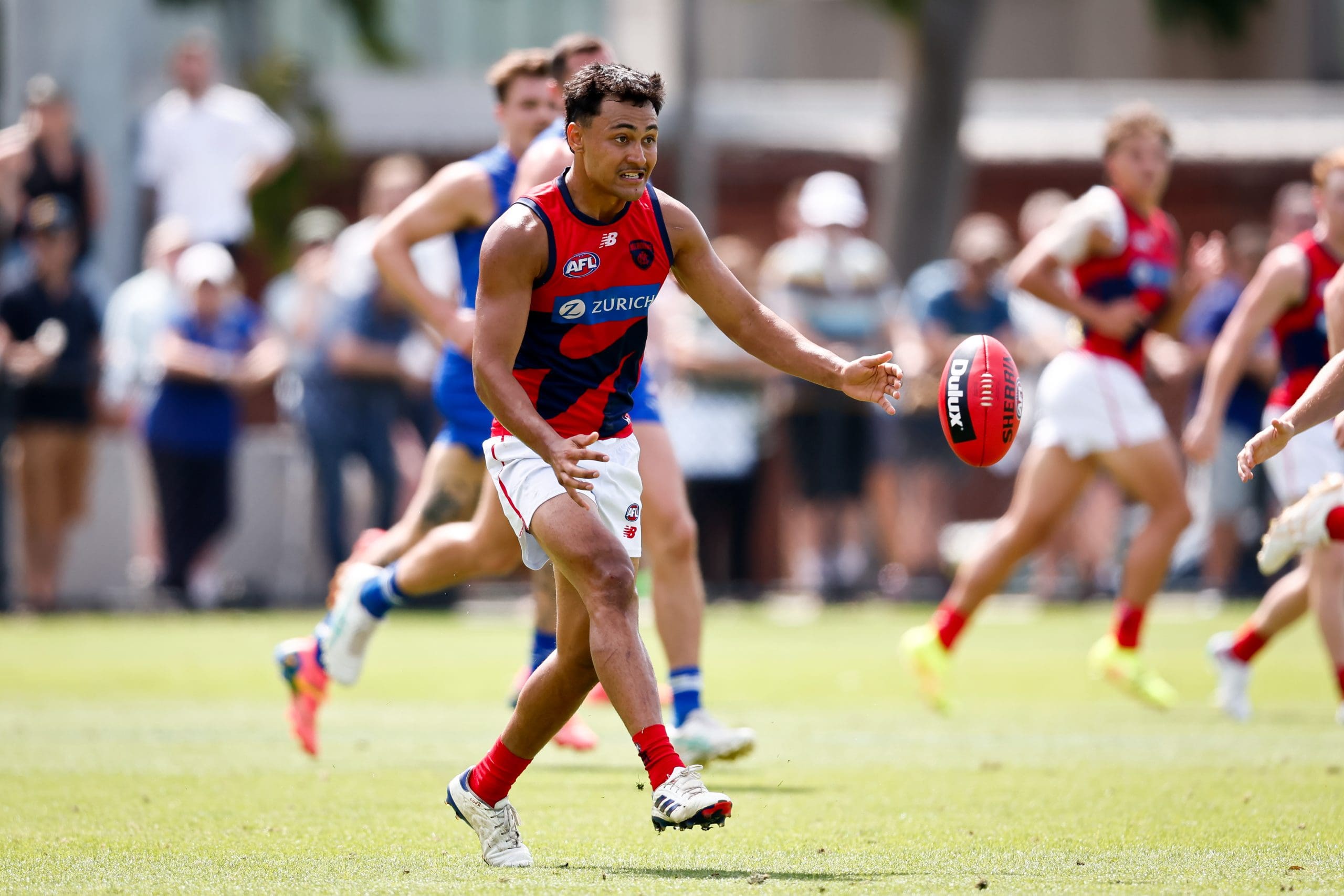 MELBOURNE, AUSTRALIA - FEBRUARY 22: Andy Moniz-Wakefield of the Demons kicks the ball during the 2025 AFL match simulation between the North Melbourne Kangaroos and Melbourne Demons at Arden Street on February 22, 2025 in Melbourne, Australia. (Photo by Dylan Burns/AFL Photos via Getty Images)