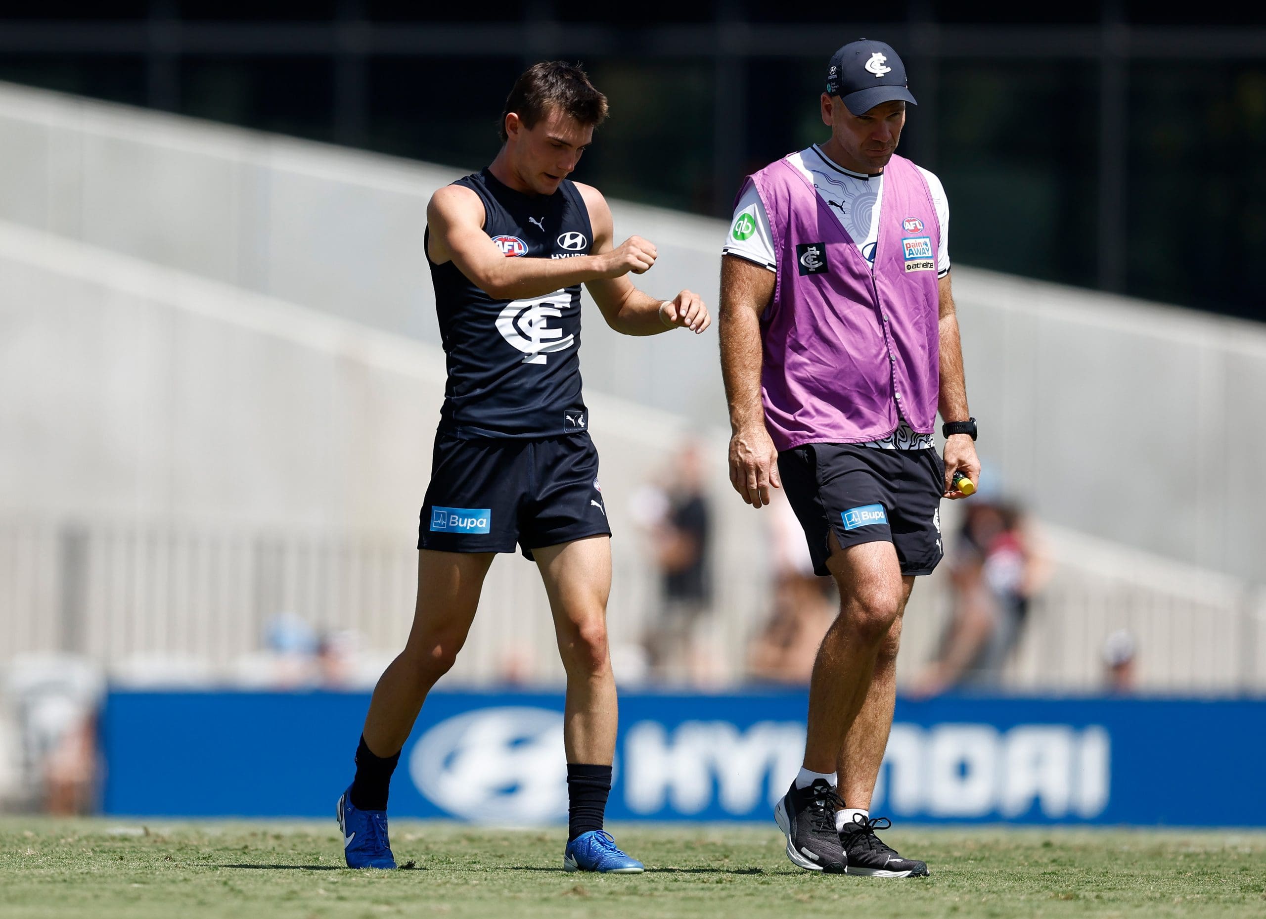 MELBOURNE, AUSTRALIA - FEBRUARY 22: Jagga Smith of the Blues limps from the field during the 2025 AFL match simulation between the Carlton Blues and St Kilda Saints at Ikon Park on February 22, 2025 in Melbourne, Australia. (Photo by Michael Willson/AFL Photos via Getty Images)