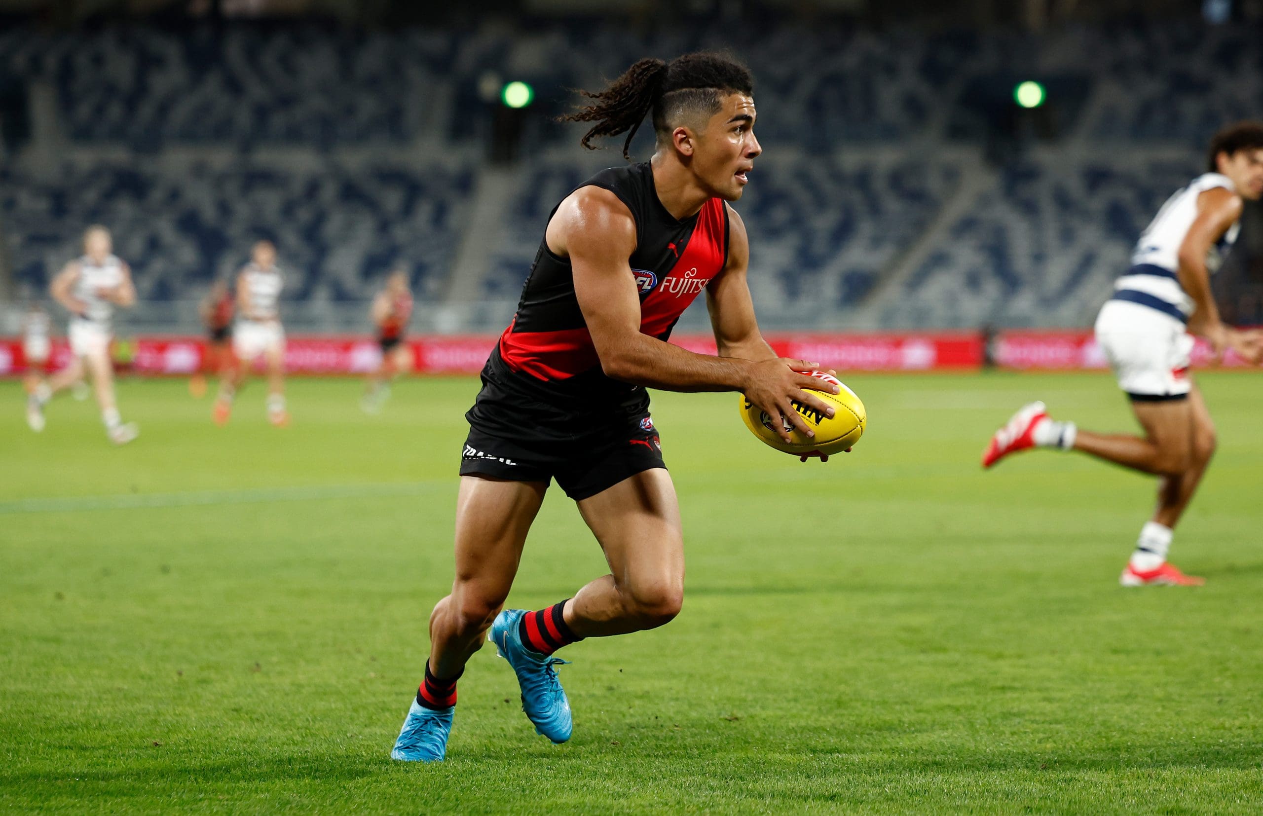 GEELONG, AUSTRALIA - FEBRUARY 25: Isaac Kako of the Bombers in action during the 2025 AFL AAMI Community Series match between the Geelong Cats and the Essendon Bombers at GMHBA Stadium on February 25, 2025 in Geelong, Australia. (Photo by Michael Willson/AFL Photos via Getty Images)