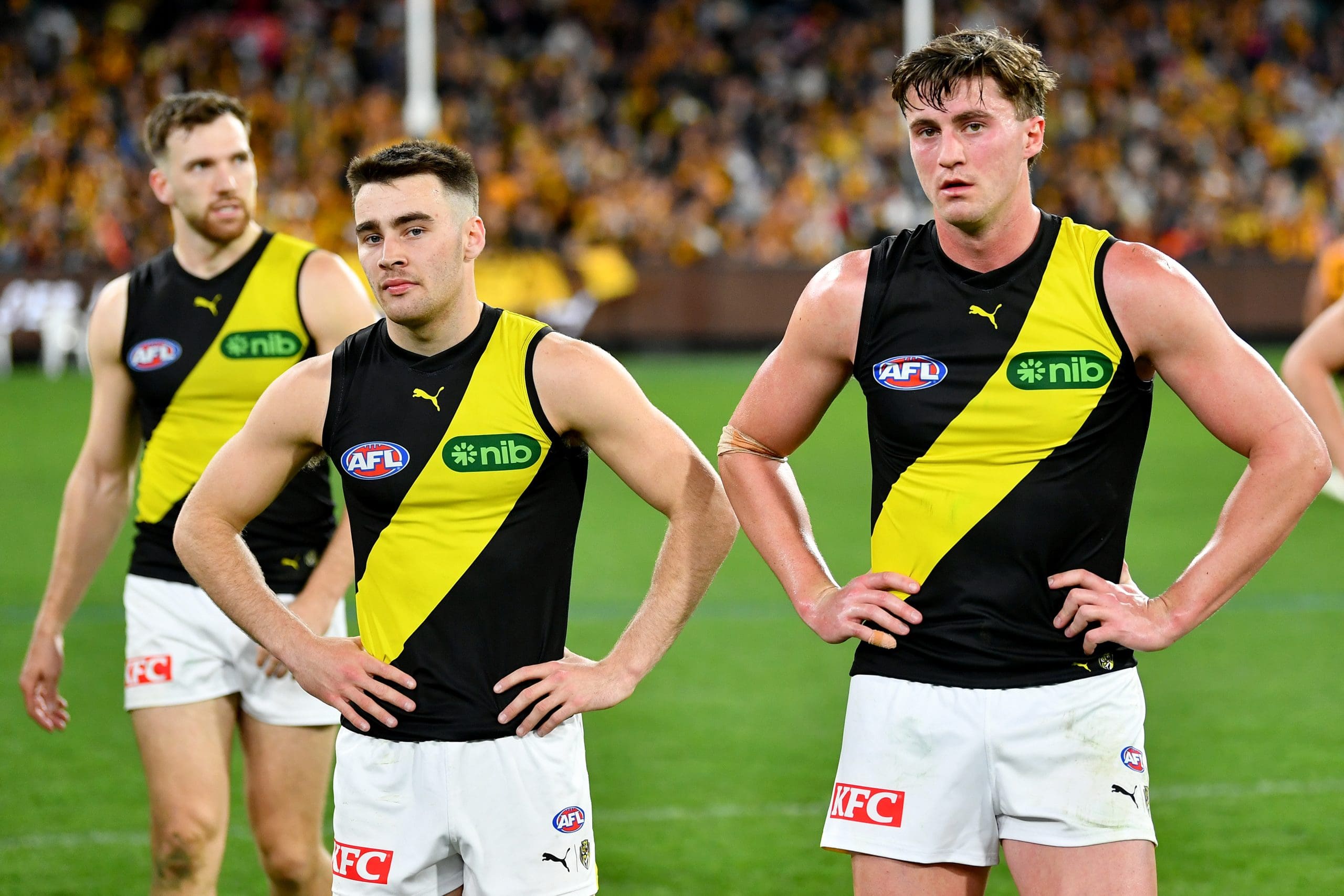 MELBOURNE, AUSTRALIA - AUGUST 18: Seth Campbell and Jacob Blight of the Tigers look dejected after losing the round 23 AFL match between Hawthorn Hawks and Richmond Tigers at Melbourne Cricket Ground, on August 18, 2024, in Melbourne, Australia. (Photo by Josh Chadwick/AFL Photos/via Getty Images)