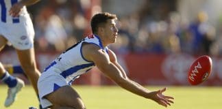 PERTH, AUSTRALIA - MARCH 01:  Jacob Konstanty of the Kangaroos reaches for the ball during the 2025 AAMI AFL Community Series match between West Coast Eagles and North Melbourne Kangaroos at Hands Oval on March 01, 2025 in Bunbury, Australia. (Photo by James Worsfold/Getty Images)