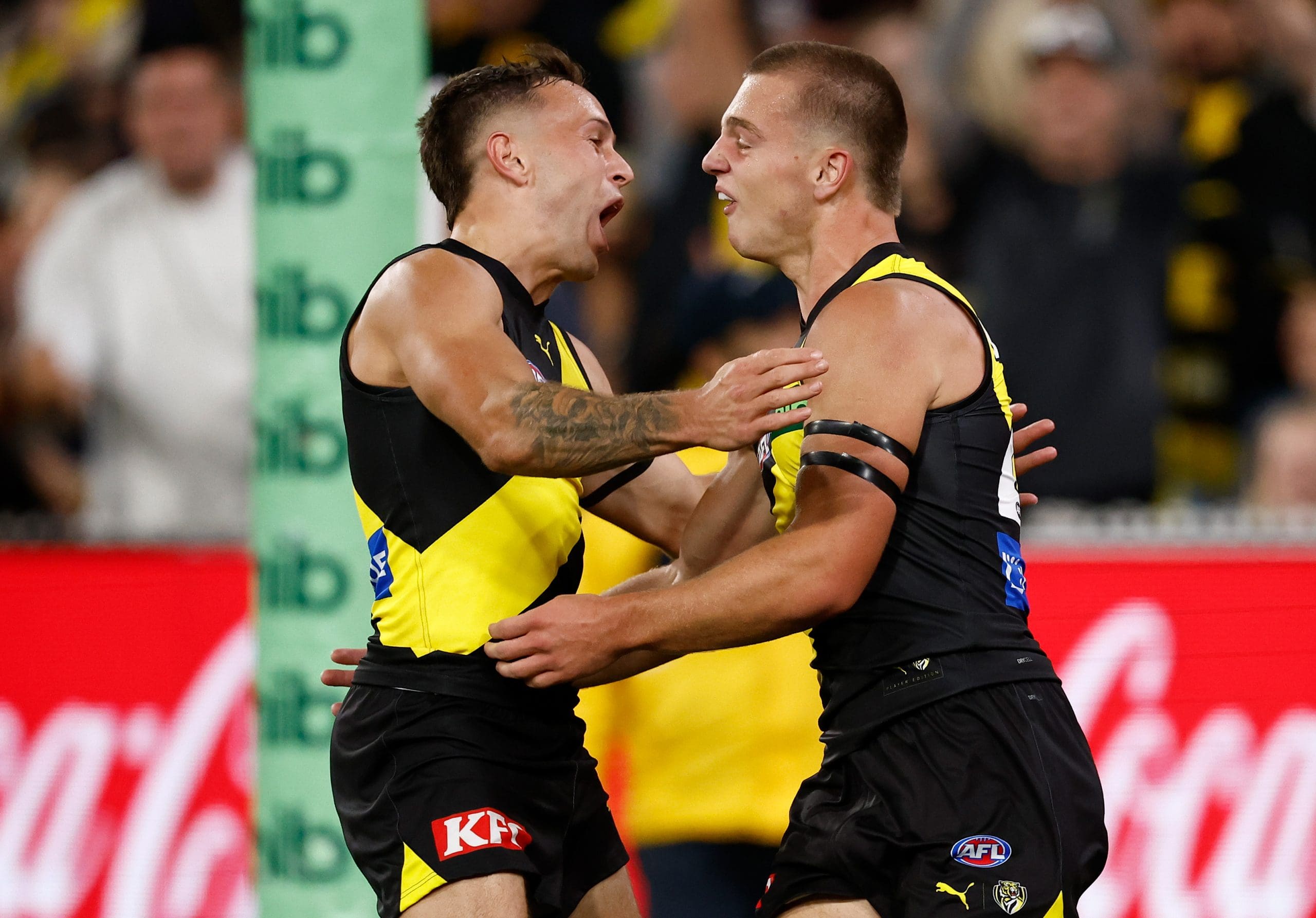 MELBOURNE, AUSTRALIA - MARCH 13: Rhyan Mansell (left) and Sam Lalor of the Tigers celebrate during the 2025 AFL Round 01 match between the Richmond Tigers and the Carlton Blues at the Melbourne Cricket Ground on March 13, 2025 in Melbourne, Australia. (Photo by Michael Willson/AFL Photos via Getty Images)