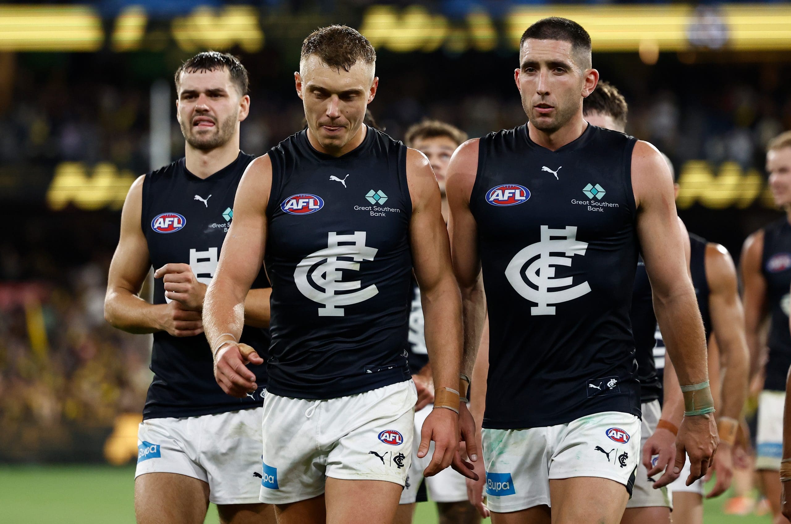 MELBOURNE, AUSTRALIA - MARCH 13: Patrick Cripps (left) and Jacob Weitering of the Blues look dejected after a loss during the 2025 AFL Round 01 match between the Richmond Tigers and the Carlton Blues at the Melbourne Cricket Ground on March 13, 2025 in Melbourne, Australia. (Photo by Michael Willson/AFL Photos via Getty Images)