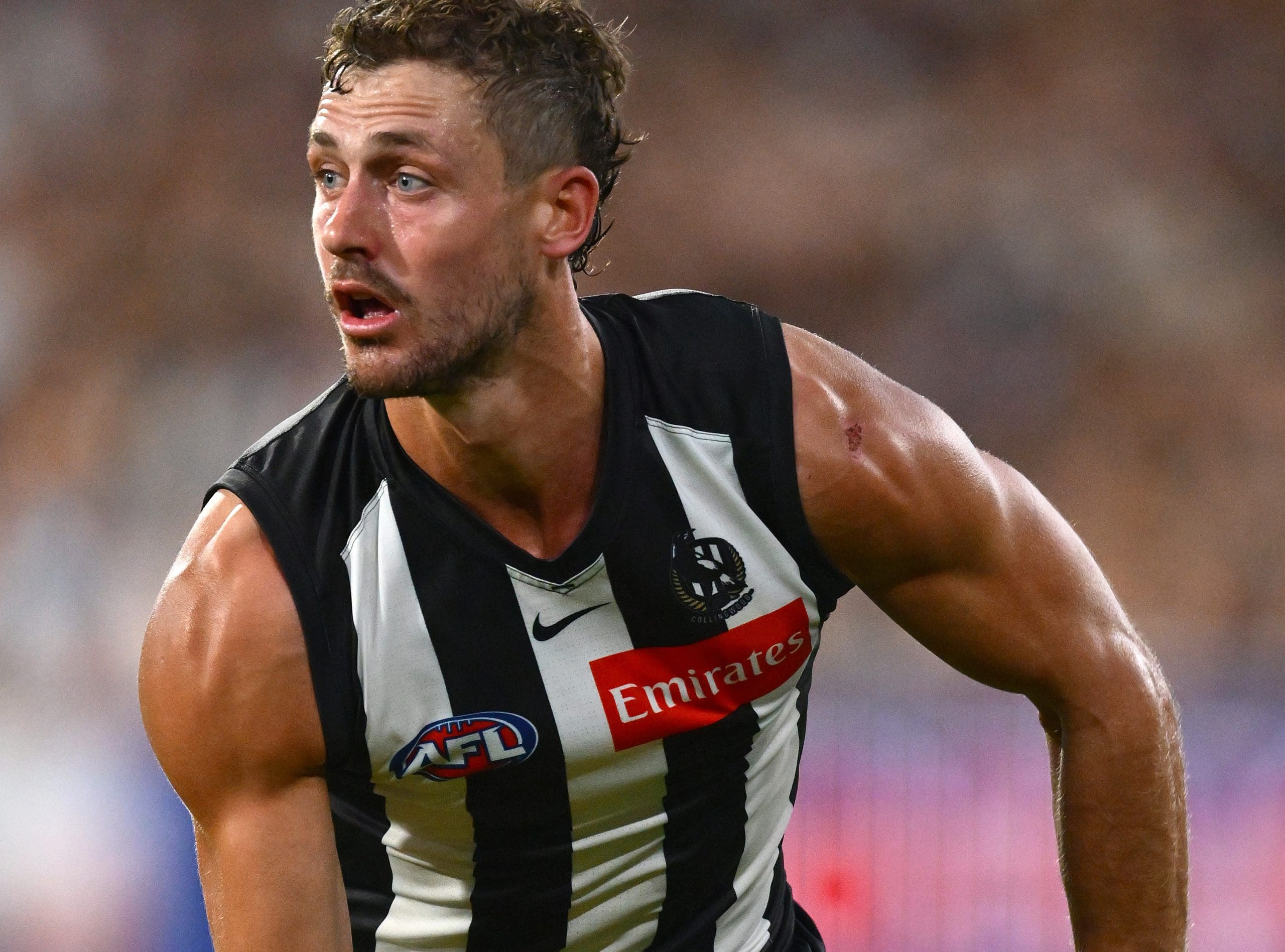 MELBOURNE, AUSTRALIA - MARCH 15: Harry Perryman of the Magpies handballs during the round one AFL match between Collingwood Magpies and Port Adelaide Power at Melbourne Cricket Ground, on March 15, 2025, in Melbourne, Australia. (Photo by Quinn Rooney/Getty Images)