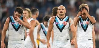 MELBOURNE, AUSTRALIA - MARCH 15: The Power look dejected after losing the round one AFL match between Collingwood Magpies and Port Adelaide Power at Melbourne Cricket Ground, on March 15, 2025, in Melbourne, Australia. (Photo by Quinn Rooney/Getty Images)