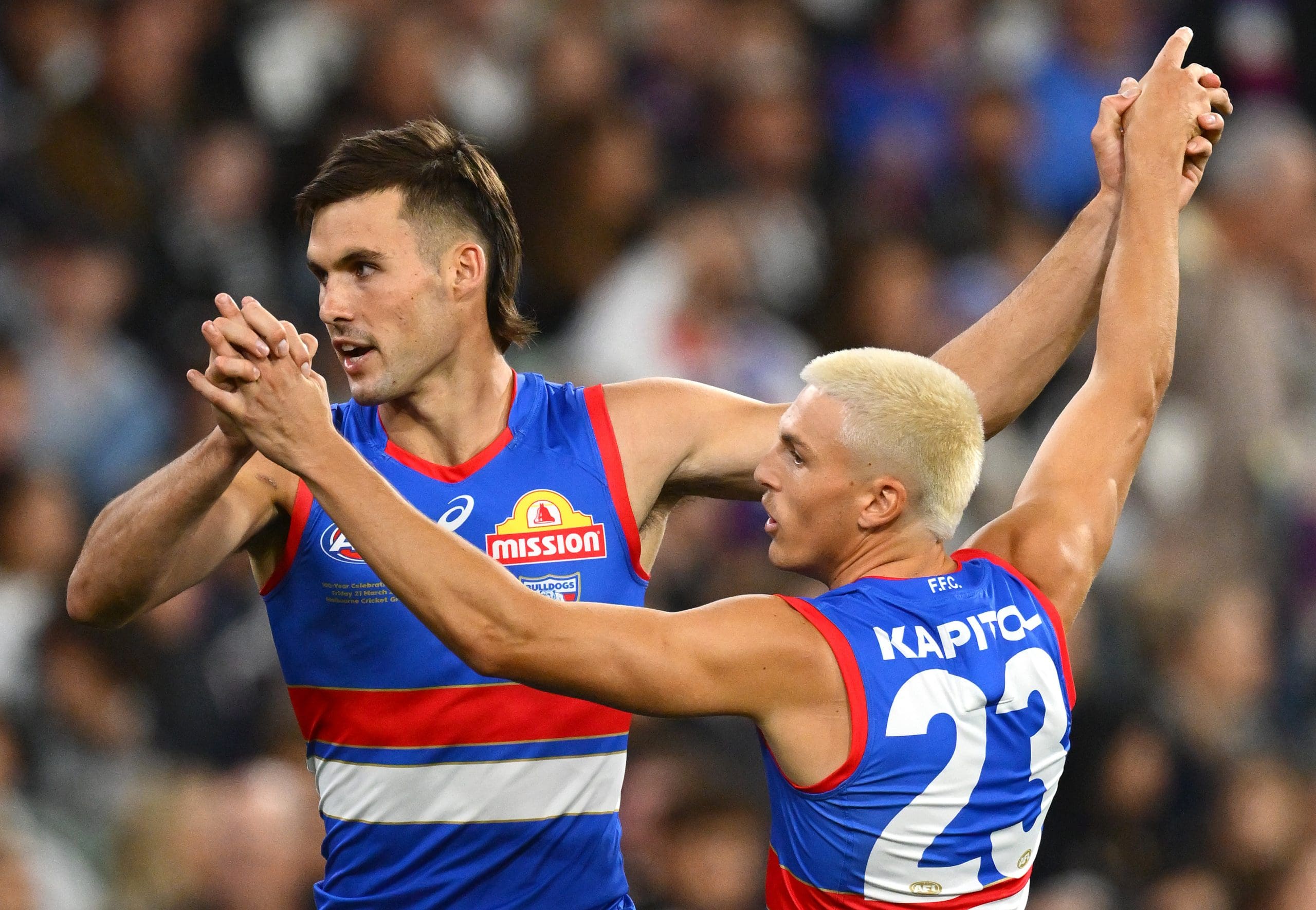 MELBOURNE, AUSTRALIA - MARCH 21: Sam Darcy of the Bulldogs is congratulated by Laitham Vandermeer of the Bulldogs after kicking a goal during the round two AFL match between Footscray Bulldogs (Western Bulldogs) and Collingwood Magpies at Melbourne Cricket Ground, on March 21, 2025, in Melbourne, Australia. (Photo by Quinn Rooney/Getty Images)