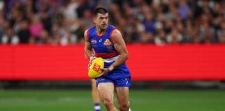 MELBOURNE, AUSTRALIA - MARCH 21: Matthew Kennedy of the Bulldogs takes possession of the ball during the round two AFL match between Footscray Bulldogs (Western Bulldogs) and Collingwood Magpies at Melbourne Cricket Ground, on March 21, 2025, in Melbourne, Australia. (Photo by Morgan Hancock/AFL Photos/Getty Images)